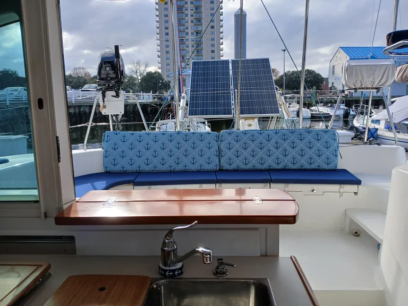 Slide: The Image of Lagoon 380 S2 yacht interior with anchor-patterned cushions and solar panels, 2007 model. - 26