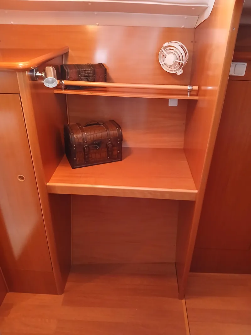 Slide: The Image of Wooden interior of 2007 Lagoon 380 S2 yacht with decorative chest and nautical decor. - 33