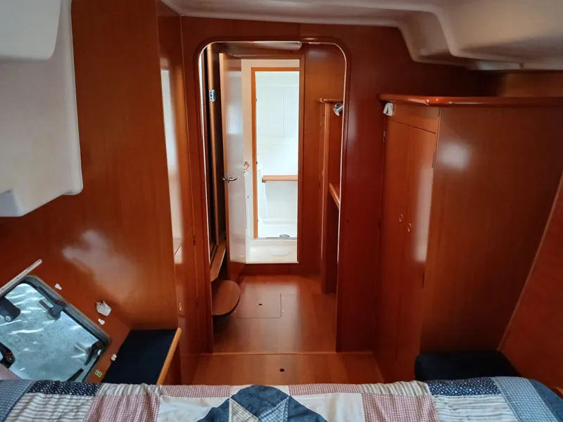 Slide: The Image of Interior of 2007 Lagoon 380 S2 yacht cabin with wood finish and cozy layout. - 34