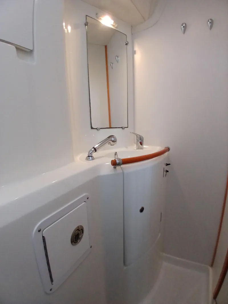 Slide: The Image of 2007 Lagoon 380 S2 yacht bathroom with modern sink and mirror. - 35