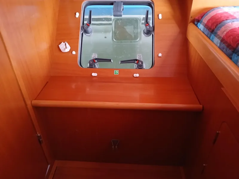 Slide: The Image of Interior cabin of 2007 Lagoon 380 S2 yacht with wooden finish and window. - 40