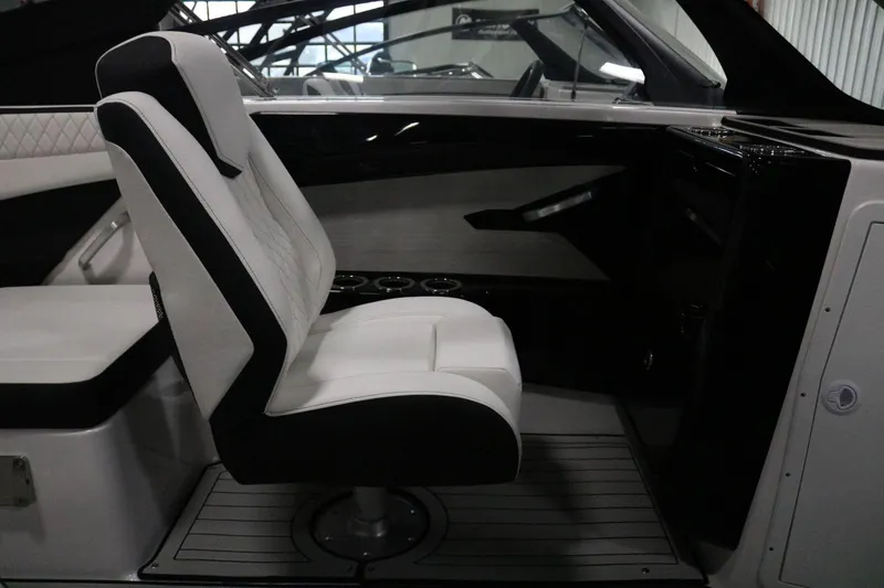 Slide: The Image of 2025 Yamaha Boats 222S interior with sleek white and black seating. - 11