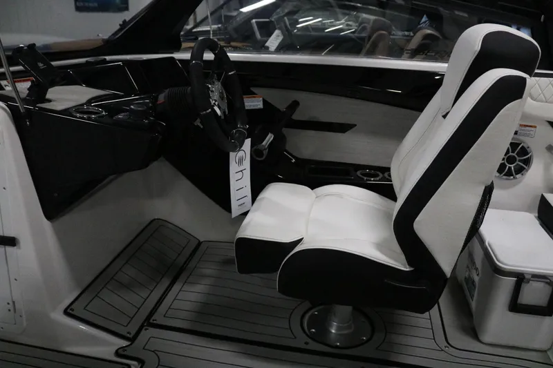 Slide: The Image of 2025 Yamaha Boats 222S interior with sleek steering and comfortable seating. - 14