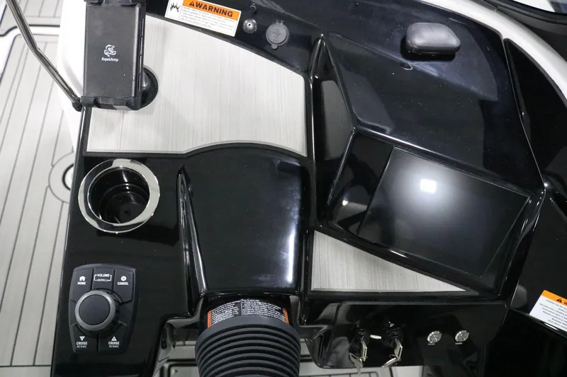 Slide: The Image of 2025 Yamaha Boats 222S dashboard with controls and display screen. - 16