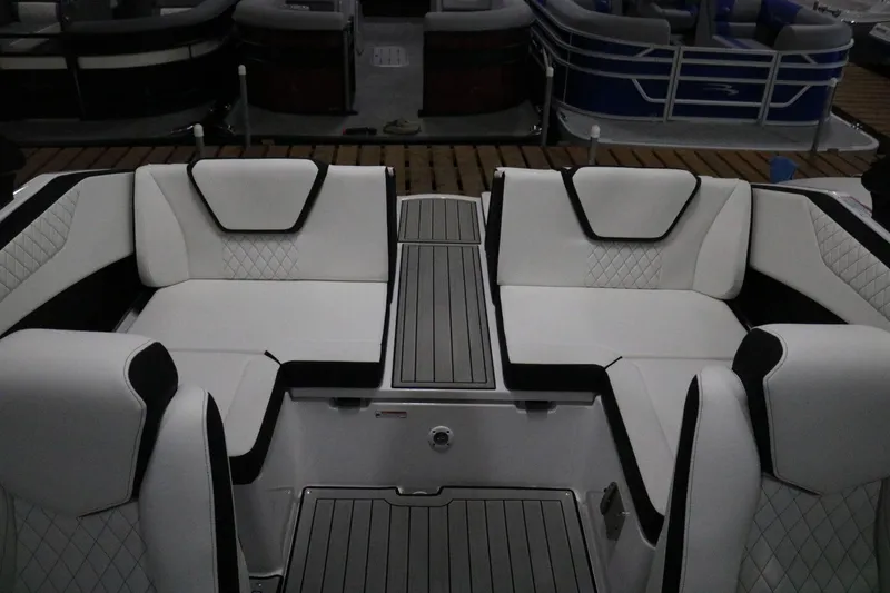 Slide: The Image of 2025 Yamaha Boats 222S interior with white and black seating, modern design. - 18