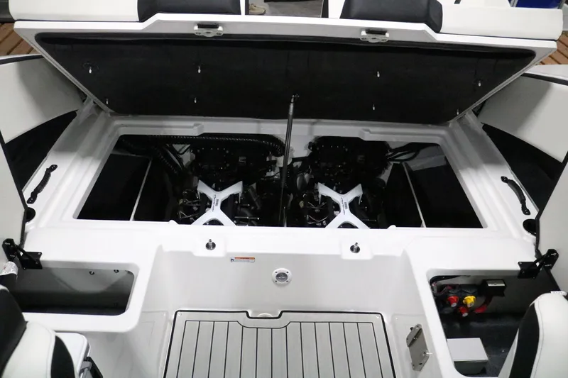 Slide: The Image of 2025 Yamaha Boats 222S engine compartment with dual engines and open hatch. - 19