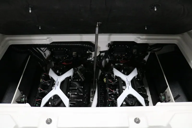 Slide: The Image of 2025 Yamaha Boats 222S engine compartment with dual engines. - 20