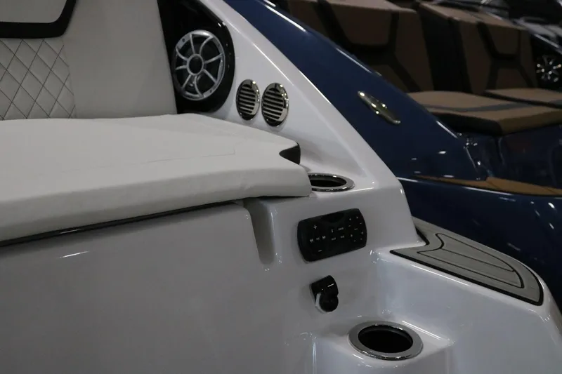Slide: The Image of 2025 Yamaha Boats 222S interior with speaker, cup holders, and control panel. - 22