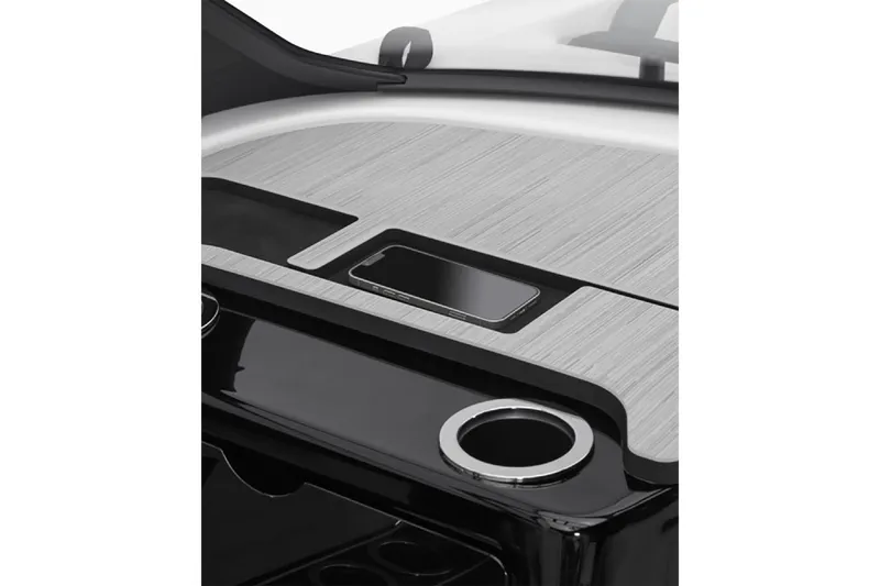 Slide: The Image of 2025 Yamaha Boats 222S dashboard with sleek design and integrated smartphone holder. - 33