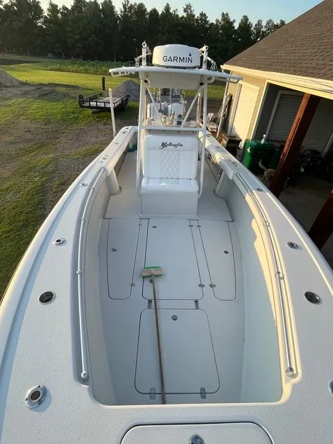 Slide: The Image of 2001 Yellowfin 31 boat with Garmin equipment, docked near a house. - 6