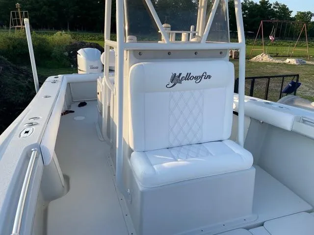 Slide: The Image of 2001 Yellowfin 31 boat interior with white seating and console. - 7