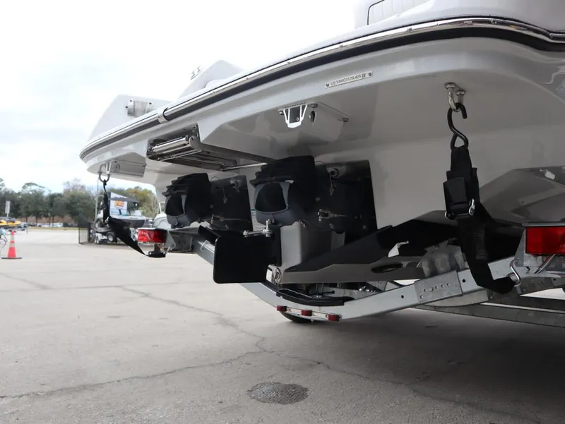 Slide: The Image of 2025 Yamaha Boats 222 FSH Sport E rear view, showcasing dual engines and trailer setup. - 17