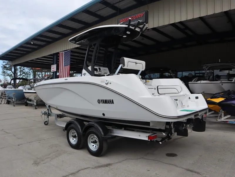 Slide: The Image of 2025 Yamaha Boats 222 FSH Sport E on trailer at dealership. - 4