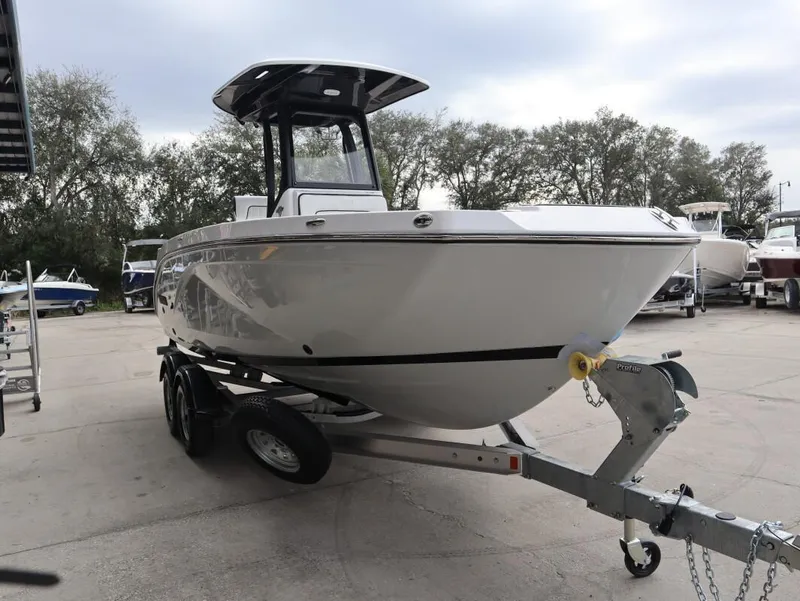 Slide: The Image of 2025 Yamaha Boats 222 FSH Sport E on trailer, parked outdoors. - 5
