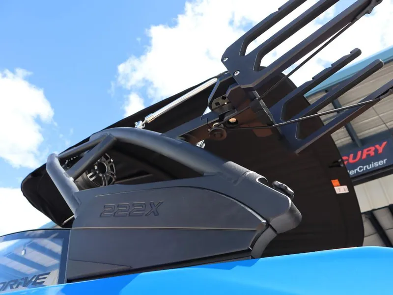 Slide: The Image of 2025 Yamaha Boats 222XD, close-up of sleek design and features under blue sky. - 10