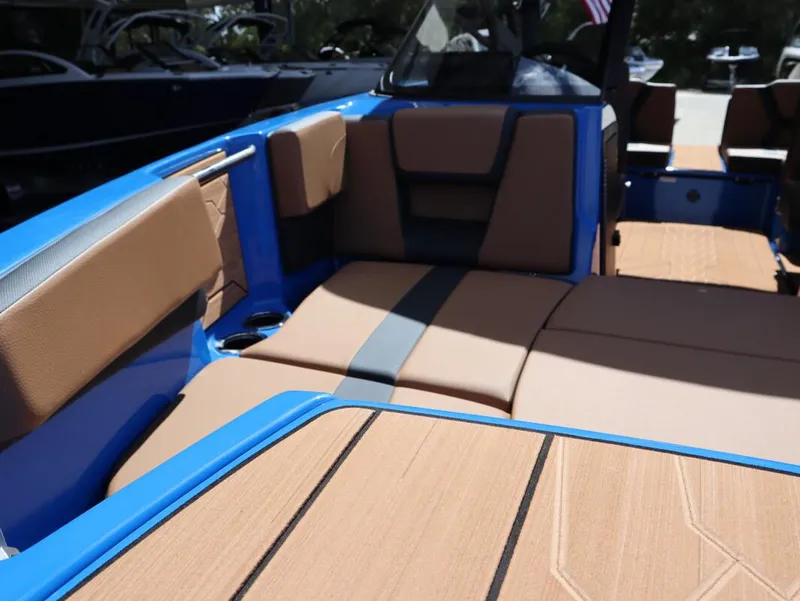Slide: The Image of 2025 Yamaha Boats 222XD interior with tan and blue seating. - 16