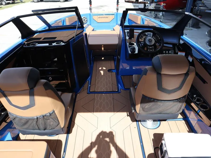 Slide: The Image of Interior of 2025 Yamaha Boats 222XD, featuring modern seating and sleek dashboard design. - 21