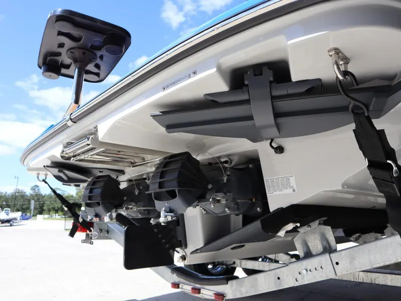 Slide: The Image of 2025 Yamaha Boats 222XD rear view, showcasing dual engines and trailer setup. - 5