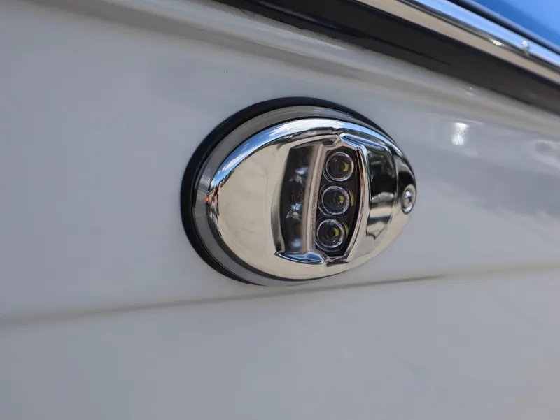 Slide: The Image of Close-up of 2025 Yamaha Boats 222XD chrome LED light fixture. - 8