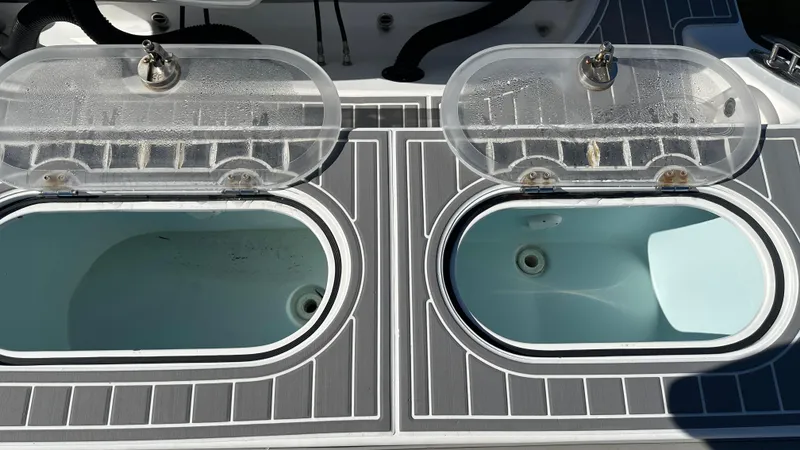 Slide: The Image of Livewell compartments on a 2021 Blackwater 36 SF boat deck. - 14
