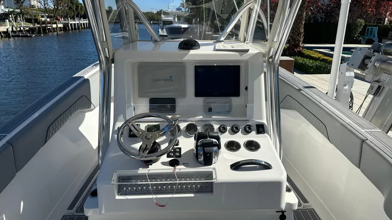 Slide: The Image of 2021 Blackwater 36 SF boat console with steering wheel and navigation controls. - 21