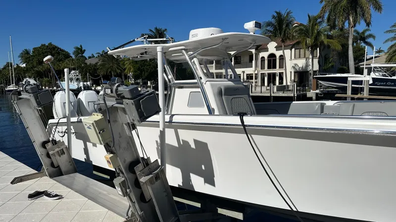Slide: The Image of 2021 Blackwater 36 SF boat docked in sunny marina with palm trees. - 3