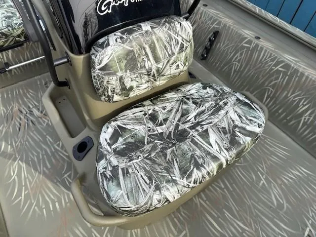 Slide: The Image of 2024 Tracker Grizzly 1860 CC boat seat with camouflage pattern. - 10