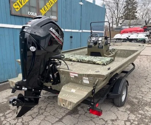 Slide: The Image of 2024 Tracker Grizzly 1860 CC boat with Mercury engine, parked at a marina. - 4