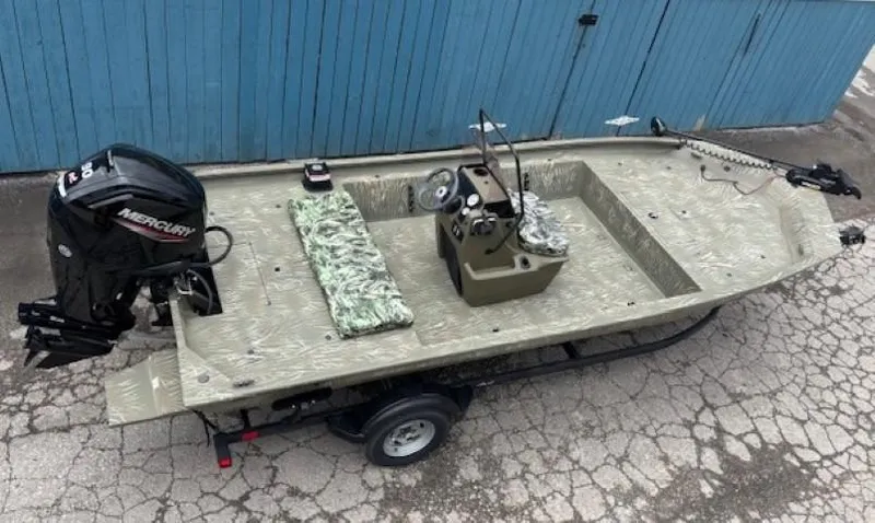 Slide: The Image of 2024 Tracker Grizzly 1860 CC boat on trailer, featuring Mercury outboard motor. - 6