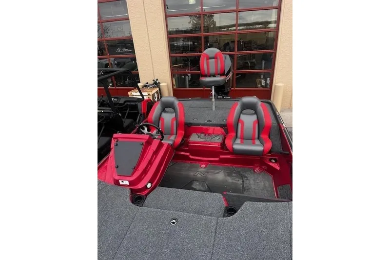 Slide: The Image of 2025 Nitro Z20 XL Pro boat interior with red and gray seating. - 115