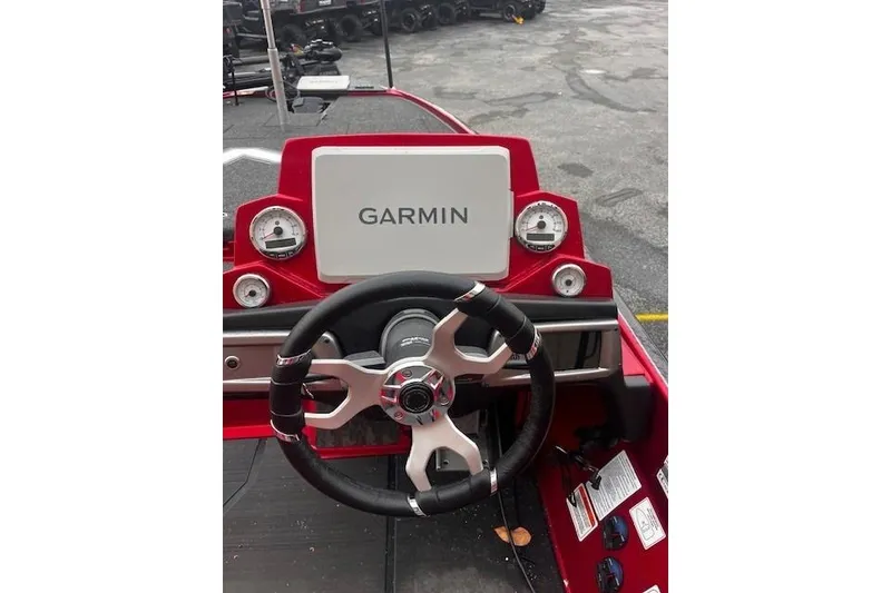 Slide: The Image of 2025 Nitro Z20 XL Pro boat dashboard with Garmin display and steering wheel. - 117