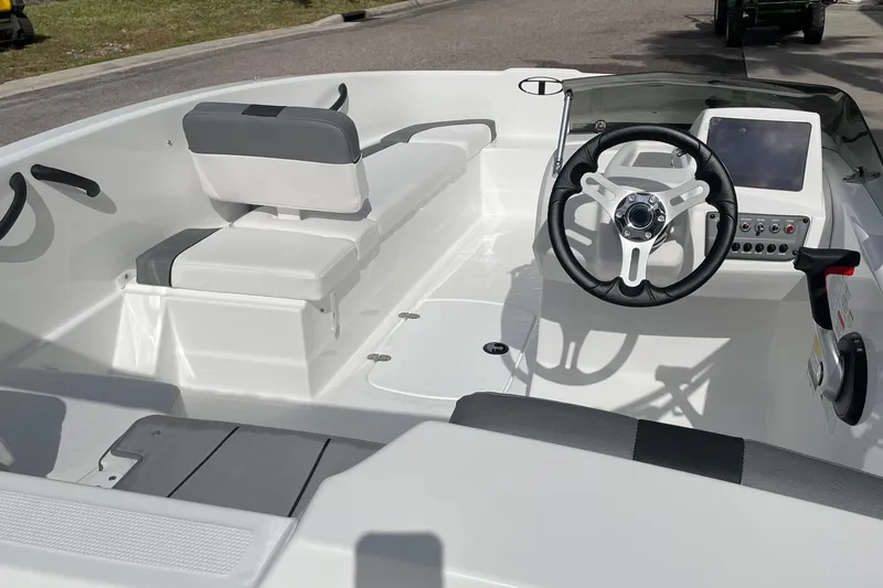 Slide: The Image of 2025 Tahoe T16 boat interior with steering wheel and seating. - 3