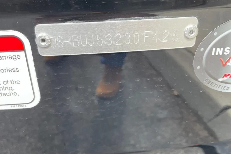 Slide: The Image of Close-up of a Tahoe T16 2025 model's identification plate and certification sticker. - 5