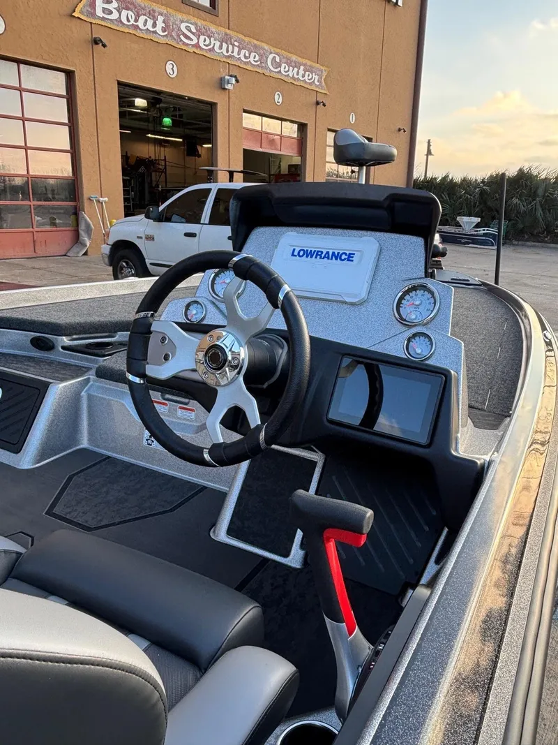 Slide: The Image of 2025 Nitro Z21 XL boat dashboard with Lowrance system at service center. - 2