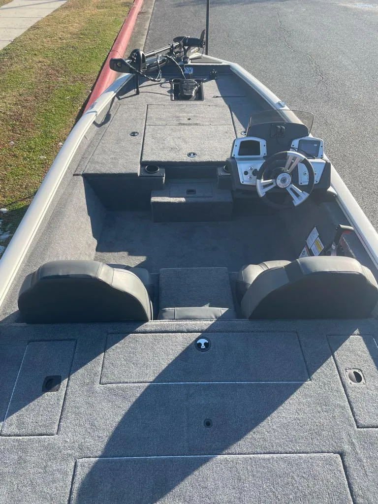 Slide: The Image of 2025 Tracker Pro Team 175 boat interior with dual seats and steering console. - 3