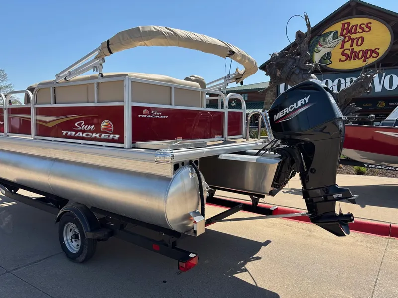 Slide: The Image of 2025 Sun Tracker Bass Buggy 16 XL Select pontoon boat with Mercury engine at Bass Pro Shops. - 2