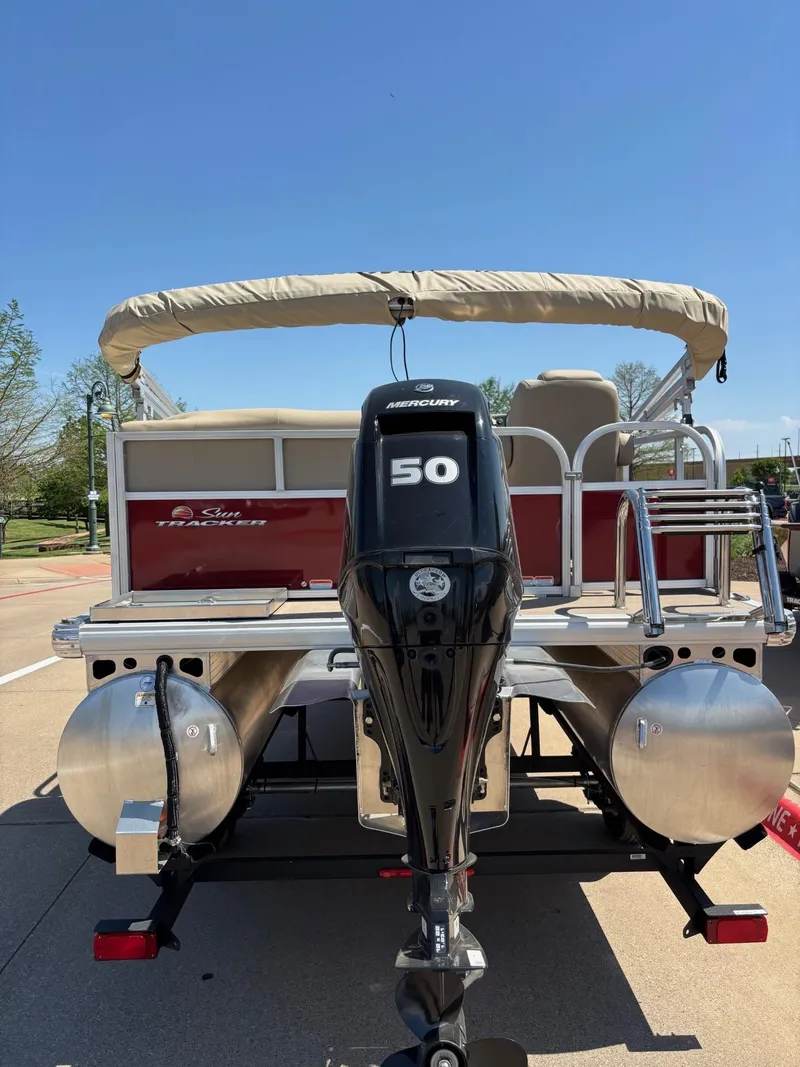 Slide: The Image of 2025 Sun Tracker Bass Buggy 16 XL Select pontoon boat with Mercury 50 HP engine. - 3