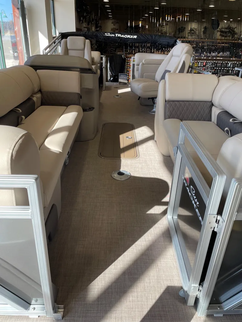 Slide: The Image of Interior of 2025 Sun Tracker Party Barge 22 XP3 with beige seating and modern design. - 2