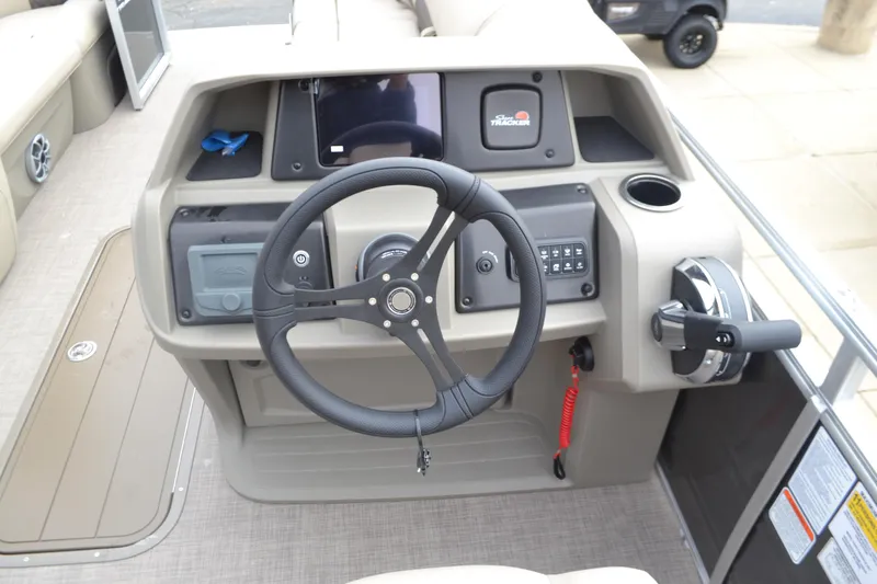 Slide: The Image of 2025 Sun Tracker Party Barge 22 XP3 steering console with modern controls and dashboard. - 3