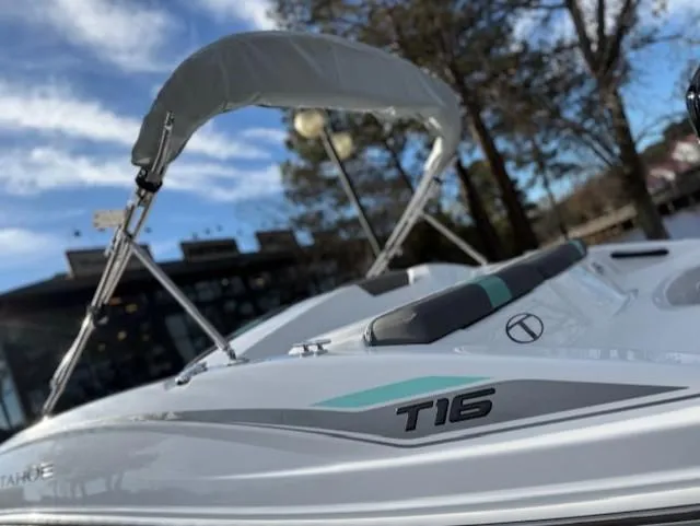 Slide: The Image of 2025 Tahoe T16 boat with canopy, sleek design, and modern features. - 41