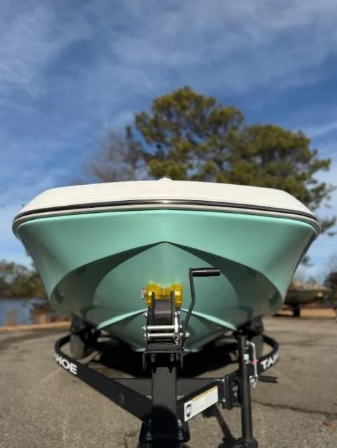 Slide: The Image of 2025 Tahoe T16 boat on trailer, front view, outdoors, clear sky. - 42