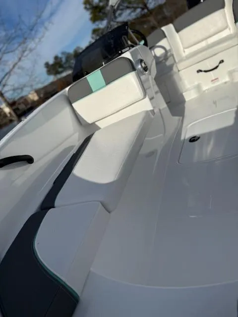 Slide: The Image of 2025 Tahoe T16 boat interior with sleek white seating and modern design. - 44
