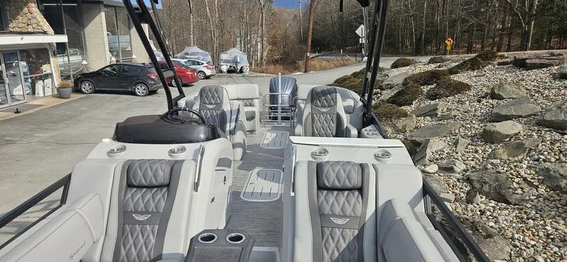 Slide: The Image of 2024 Bennington R 24 RTFBA boat interior with luxurious seating and modern design. - 6