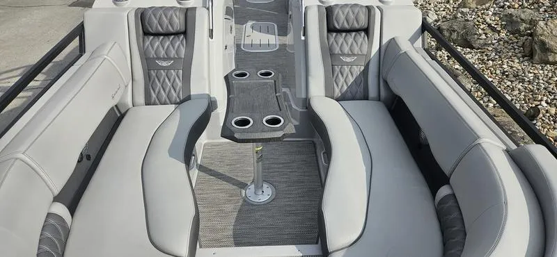 Slide: The Image of 2024 Bennington R 24 RTFBA boat interior with luxurious seating and cup holders. - 7