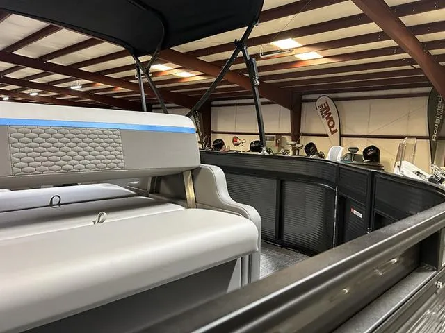 Slide: The Image of 2023 Qwest Pontoons 822 E-Class Splash Pad interior with seating and canopy in showroom. - 10