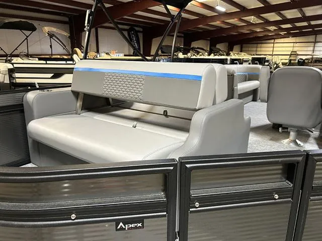 Slide: The Image of 2023 Qwest Pontoons 822 E-Class Splash Pad interior with gray seating and Apex branding. - 11