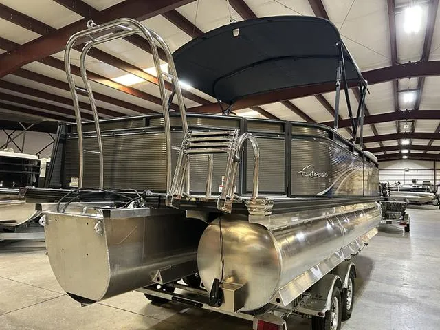 Slide: The Image of 2023 Qwest Pontoons 822 E-Class Splash Pad Triple Tube LT in a showroom. - 16