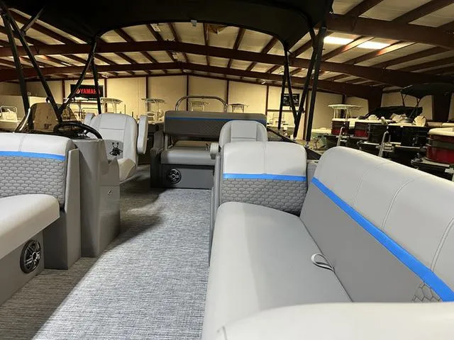 Slide: The Image of 2023 Qwest Pontoons 822 E-Class interior with spacious seating and modern design. - 4