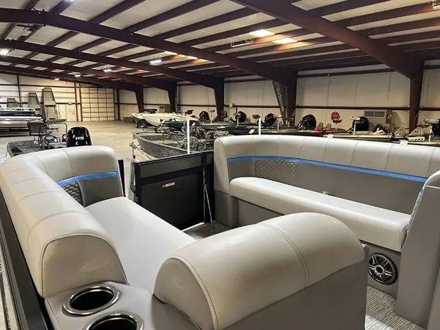 Slide: The Image of 2023 Qwest Pontoons 822 E-Class Splash Pad interior in showroom, featuring spacious seating and modern design. - 8