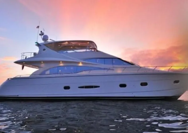 The Image of 2005 Marquis 65 yacht at sunset on the water. - 0
